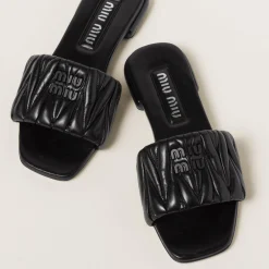 Black Matelassé Nappa Leather Slides | Miu Miu