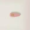 Camelia Patent Leather Hair Clip | Miu Miu