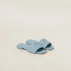 Light Blue Matelassé Nappa Leather Slides | Miu Miu