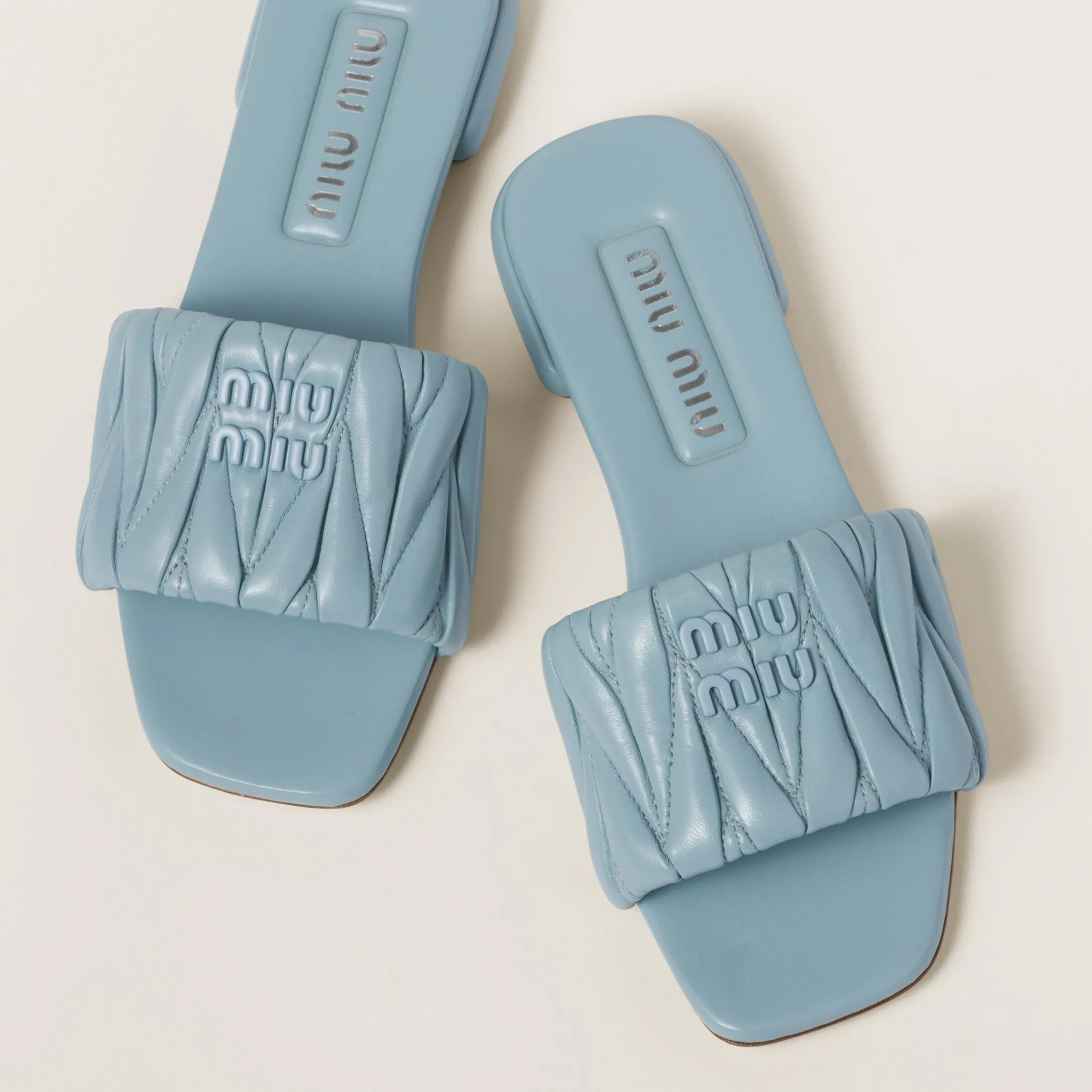 Light Blue Matelassé Nappa Leather Slides | Miu Miu